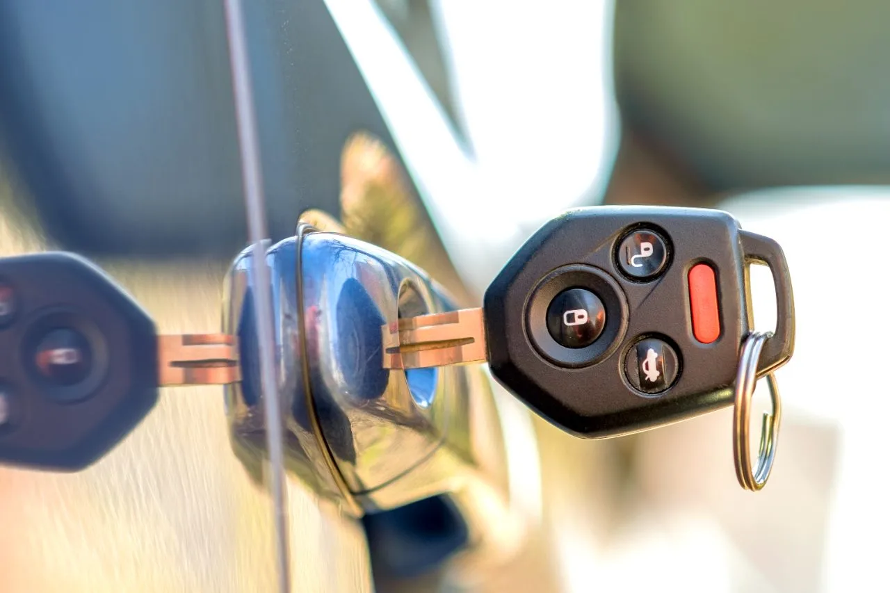 Car locksmith cutting a key in Dubai